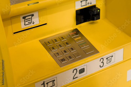 Close-up of the yellow automatic cash terminal keyboard