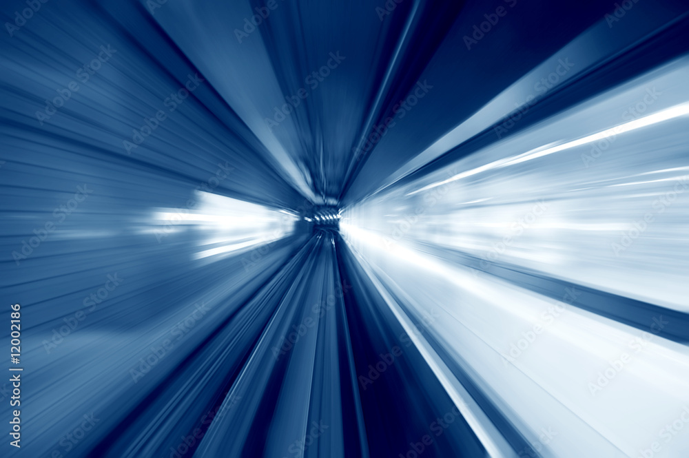 Fotografie Tunnel - Moving fast into blue tunnel