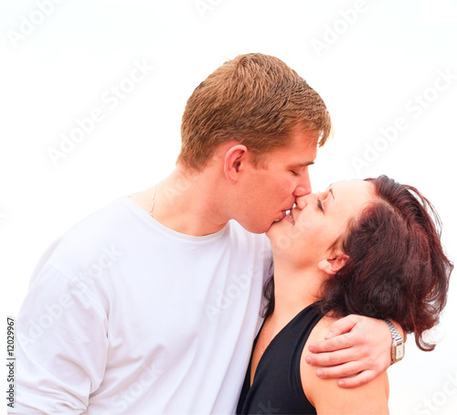couple kissing close-up isolated over white