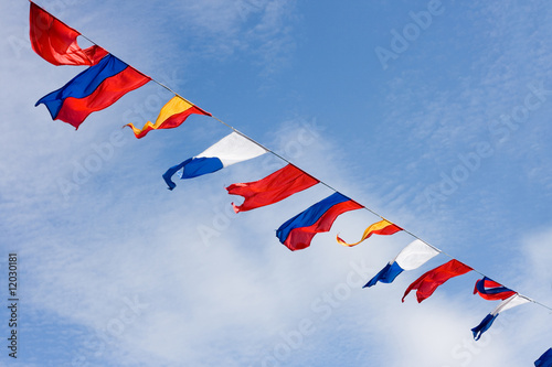 many colorful flags on the wind