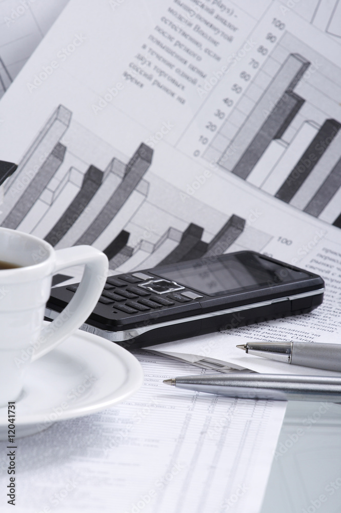 Cup coffee on a morning paper business news Cup coffee on a morning paper business news