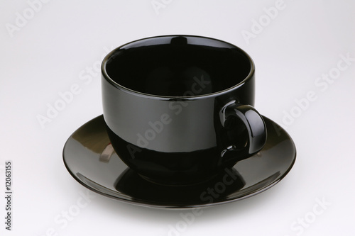 Cup with a saucer on a light background