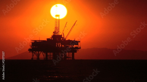 Oil Platforms At Sunset photo