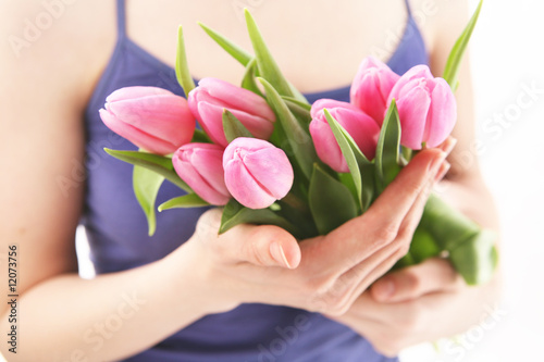 Fototapeta Naklejka Na Ścianę i Meble -  Beautiful hands holding tulips. Soft-focused.