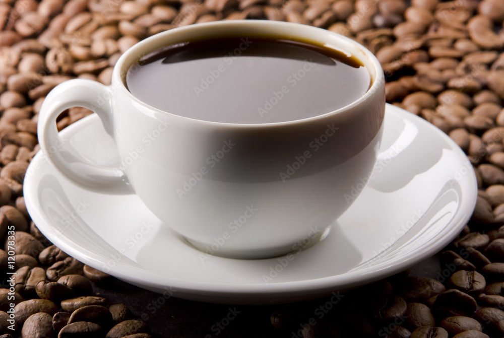 Glass Filled With Coffee on Coffee Beans Glass Filled With Coffee on Coffee Beans