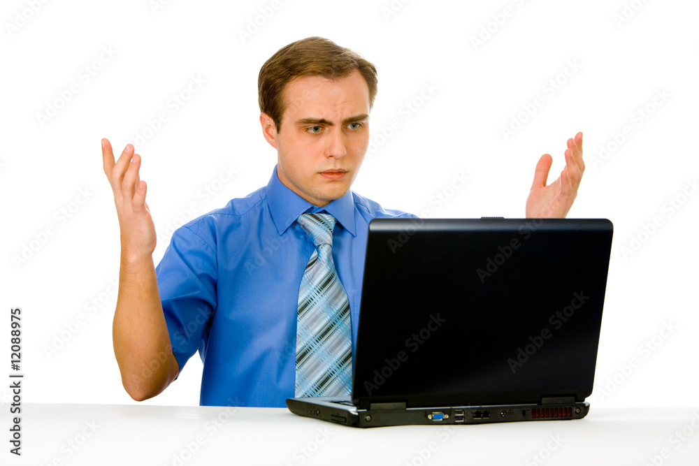 Young businessman working on a laptop. Isolated on white. Young businessman working on a laptop. Isolated on white.