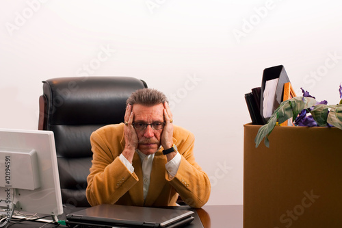 Laid-off- hands on side of head