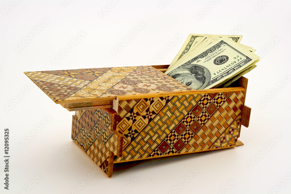 Cash hidden in a puzzle box Stock Photo Adobe Stock