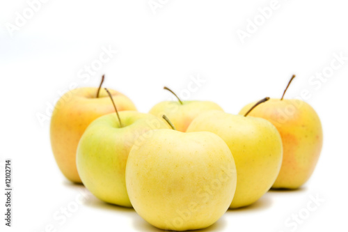 lots of yellow apples isolated on white