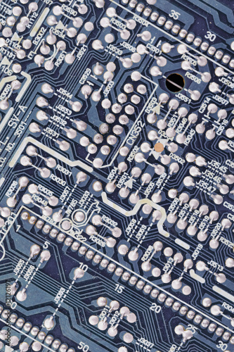 Close-up of microcircuit board. Old an dirty. Texture. © Ruslan Kokarev
