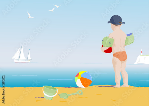 young boy on a beach watching a boat sail by