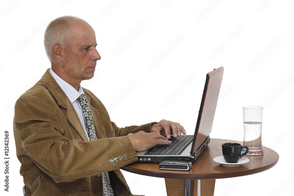 Mature man working in is laptop isolated in white Mature man working in is laptop isolated in white