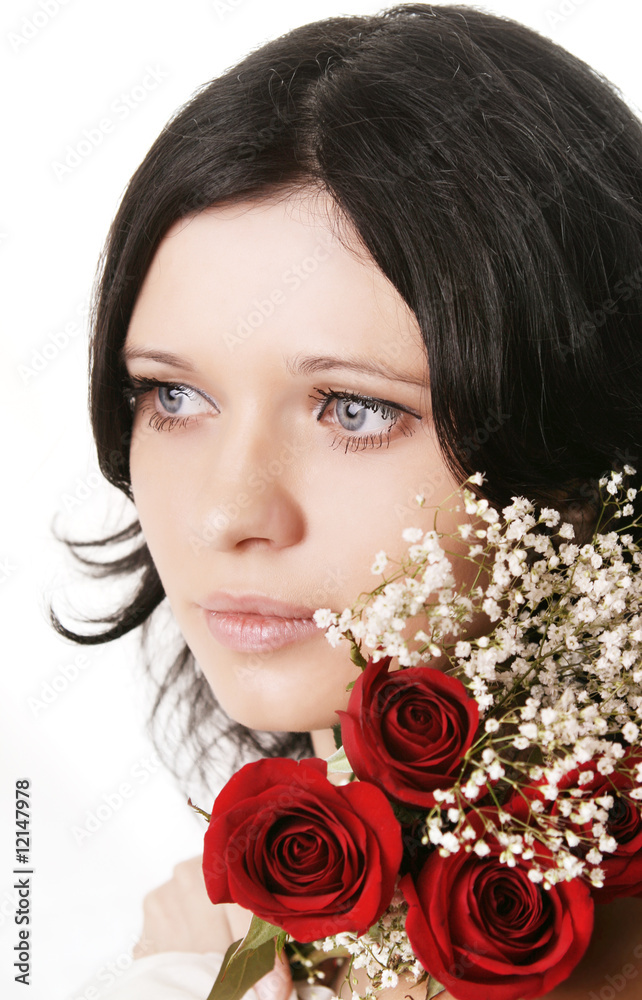 Fototapeta premium Beautiful brunette girl with a rose