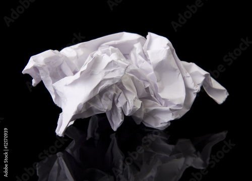 Crushed piece of paper with reflection.