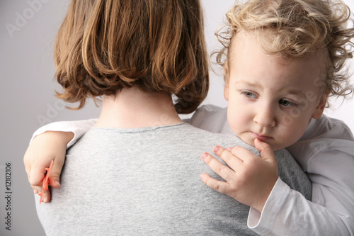 Mother holds son.