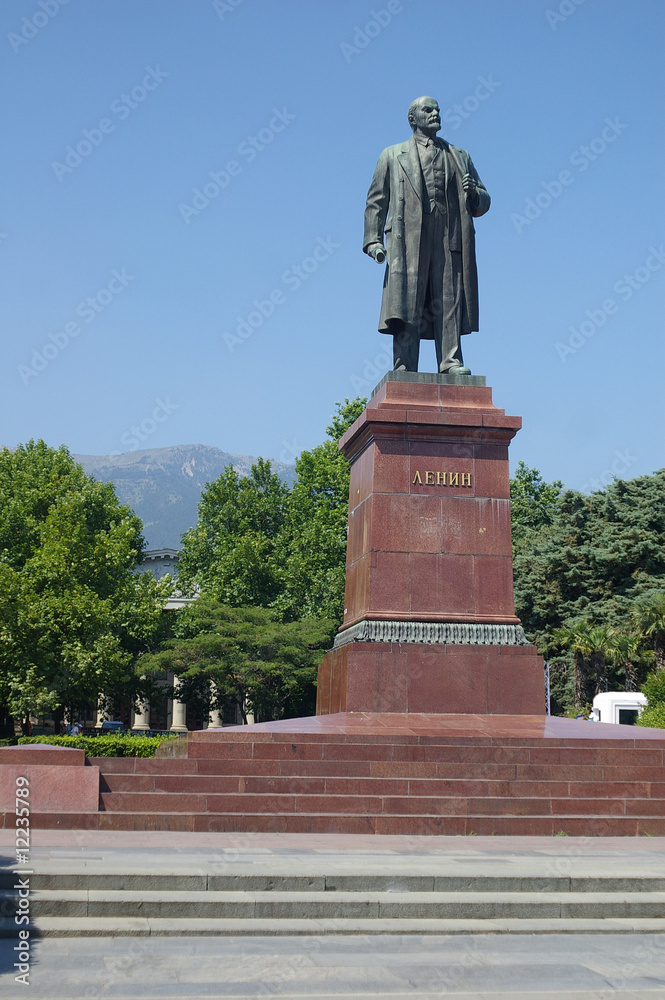 Lenin statue in Yalta with mountain and blue sky