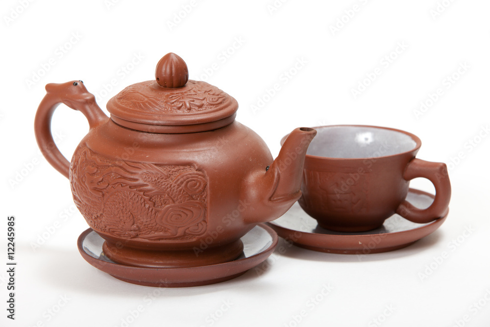 Teapot and mug on a white background. isolated image