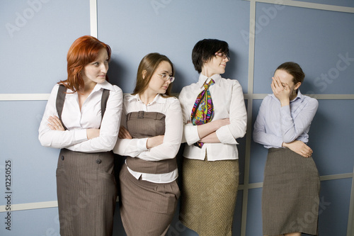 four businesswoman standing in line