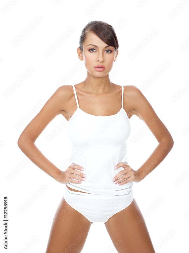 Young beautiful woman in white fitness clothing Young beautiful woman in white fitness clothing