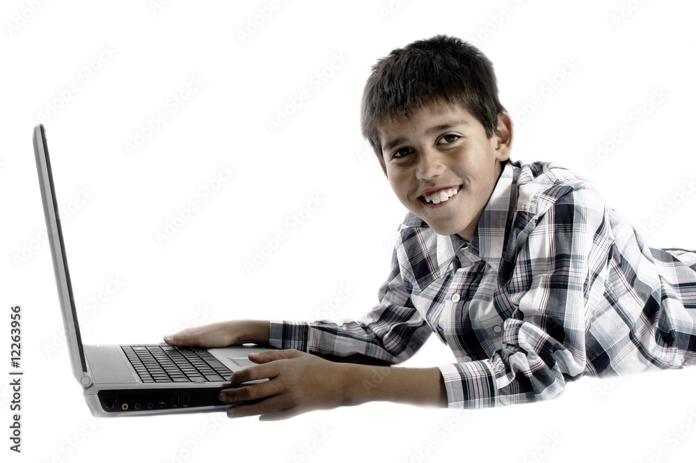 Boy spending time with notebook and modern technology Boy spending time with notebook and modern technology