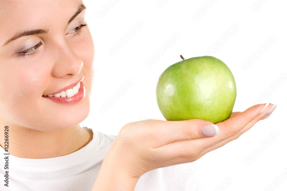 Beautiful young woman holding an apple Beautiful young woman holding an apple