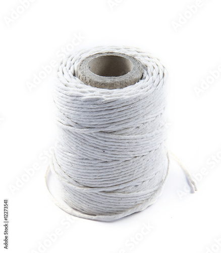 Clew of  light  packthread  on white background