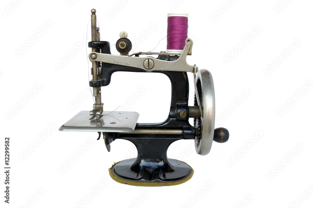 Fototapeta premium antique sewing machine isolated on white