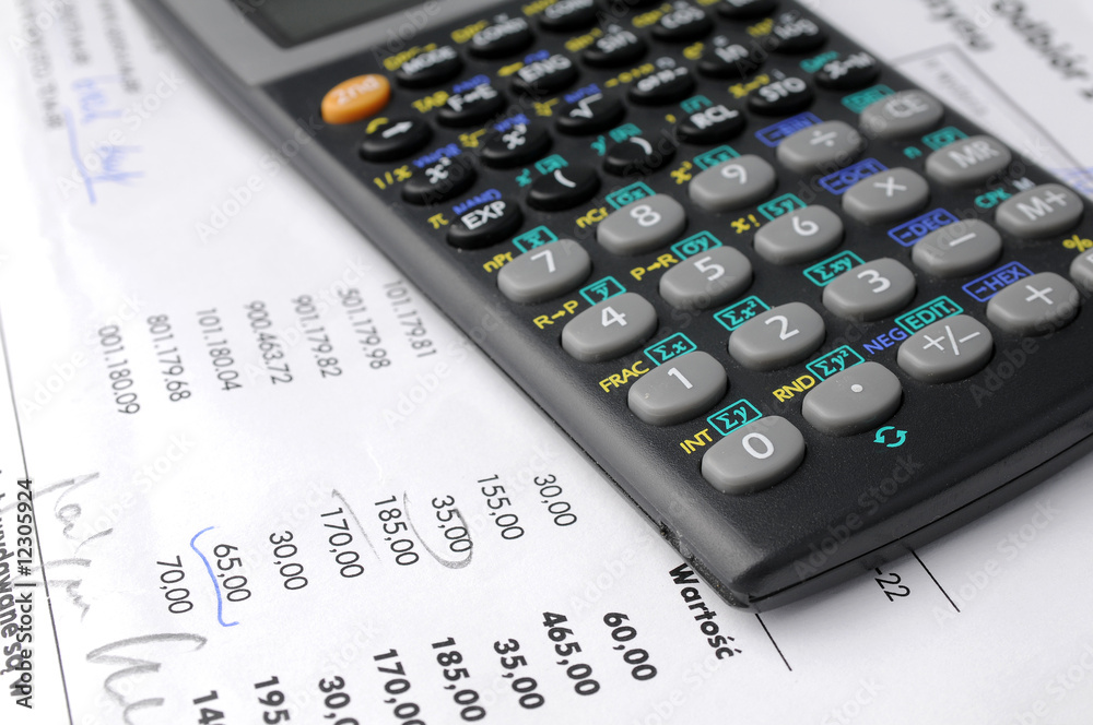Business charts and calculator on table Business charts and calculator on table