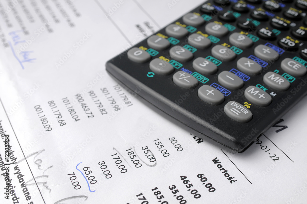 Business charts and calculator on table Business charts and calculator on table