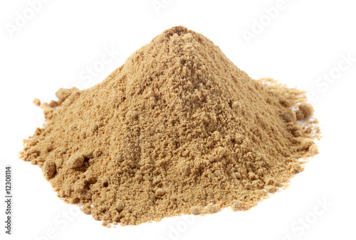spices - pile of Ginger powder over white