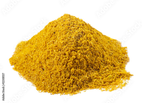 spices - pile of Hot madras curry over white