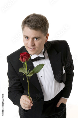 Man Holding out Rose to Camera