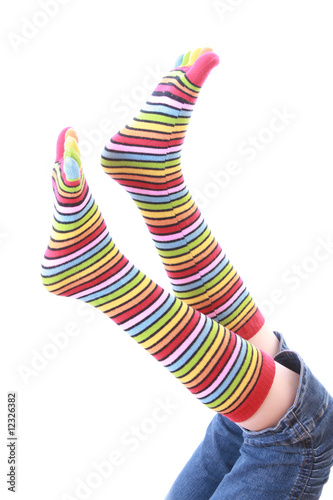 woman legs in strip sock on white background