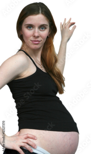 The pregnant girl on a white background