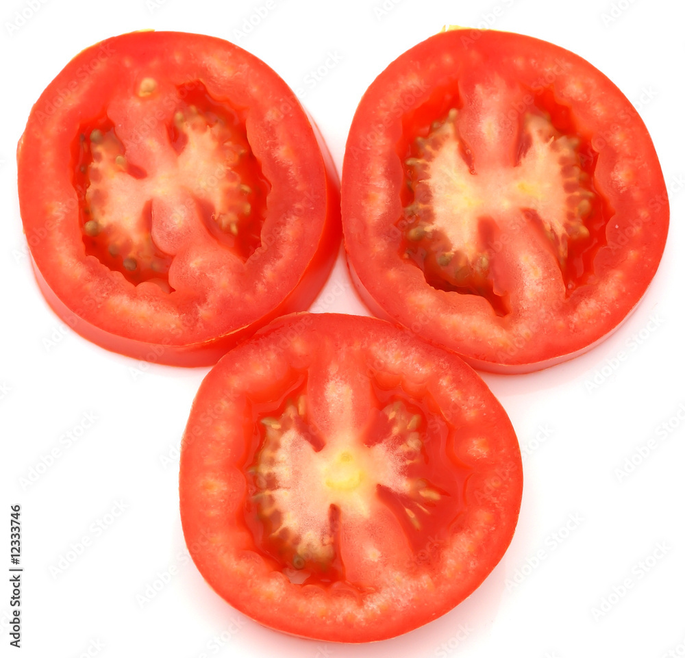 Three juicy slices of a Roma tomato ready to eat.