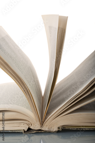 Close-up of an old worn book opened
