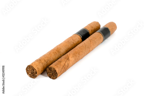 Two Cuban cigar over white background