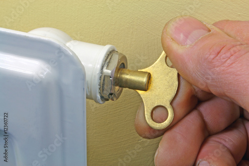 using key to bleed radiator photo