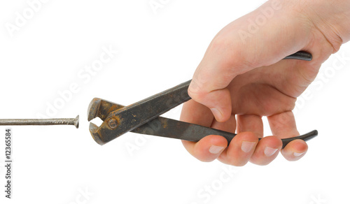 Hand with pliers and nail