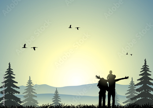 Happy family at sunset