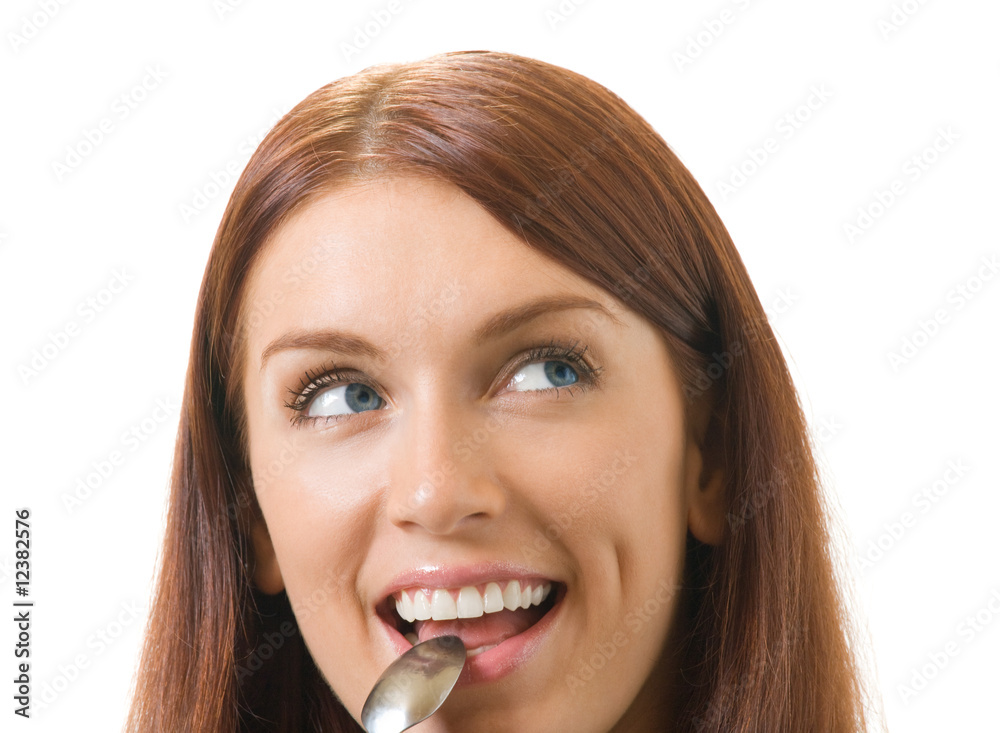 Young smiling woman with spoon, isolated on white Young smiling woman with spoon, isolated on white