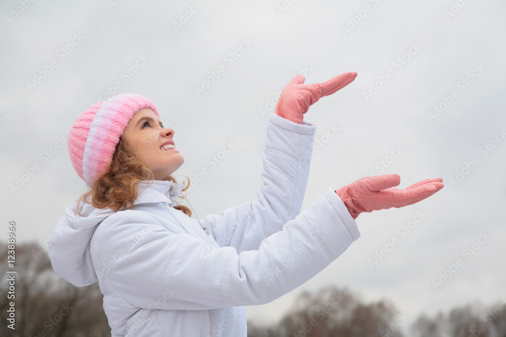 young beauty girl outdoor in winter catches snowflakes young beauty girl outdoor in winter catches snowflakes
