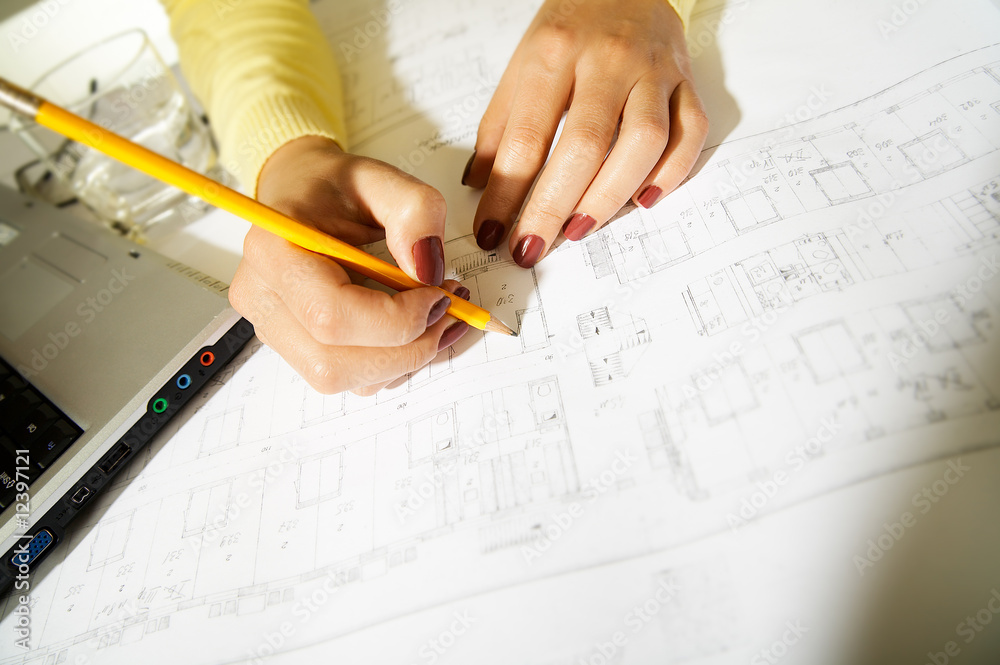 ingeneer at work, blueprints and pencil ingeneer at work, blueprints and pencil