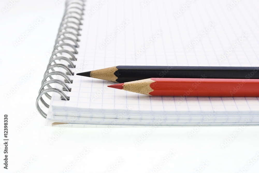 Spiral notepad with red and black pencils Spiral notepad with red and black pencils