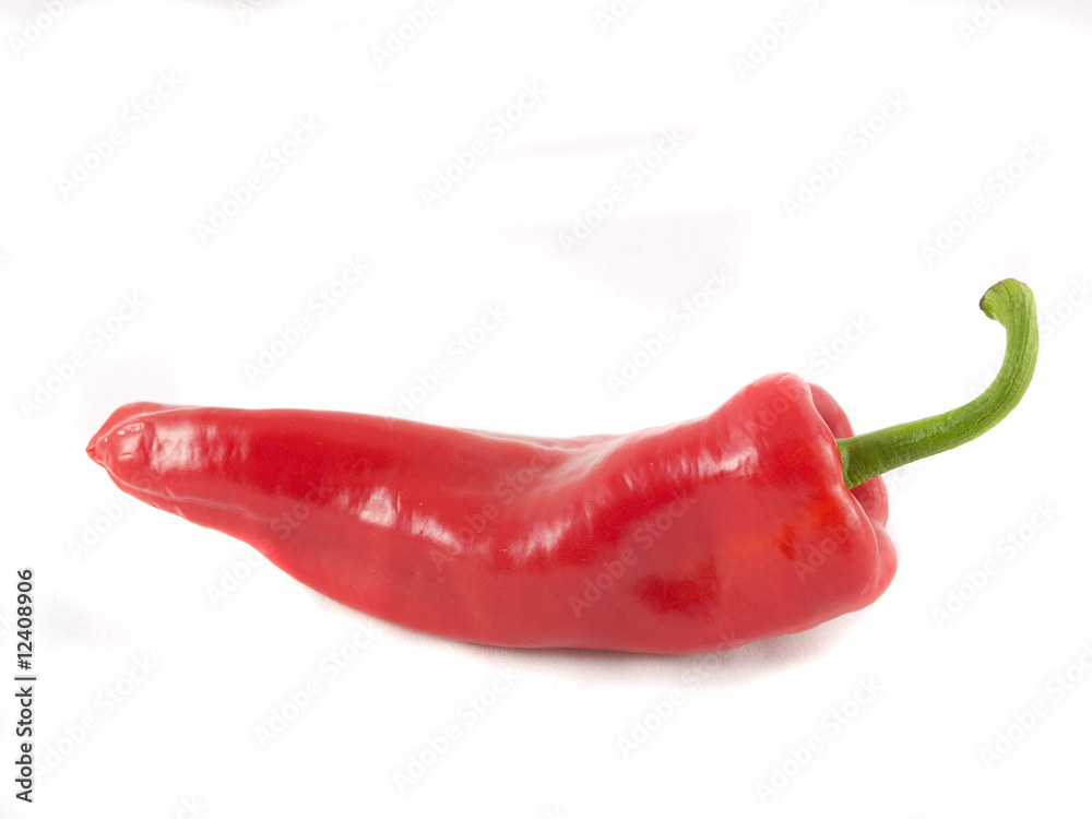 A lone, fresh red pepper