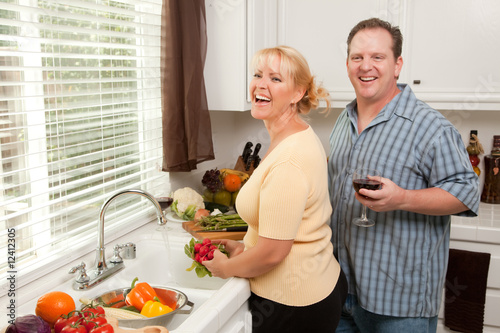 Happy Couple In Their Kitchen
