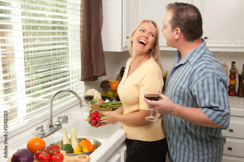 Laughing Couple Preparing a...