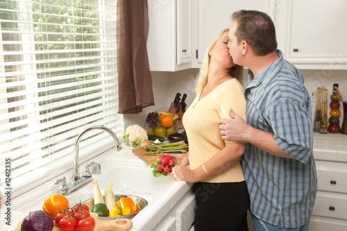 Kissing Couple Preparing a ...