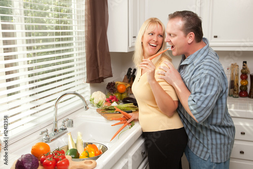 Flirtatious Couple Feeding ...