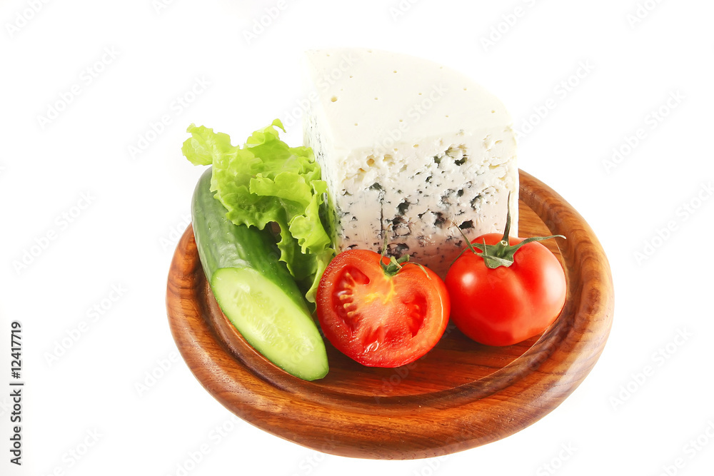 blue cheese and vegetables on wooden plate blue cheese and vegetables on wooden plate